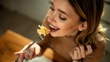 woman eating a pasta