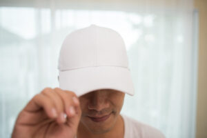 Man wearing white cap