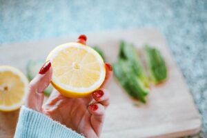 Woman holding orange slice