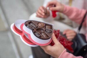 Couple sharing chocolate