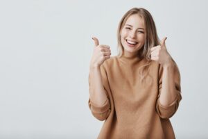 Happy woman with thumbs up