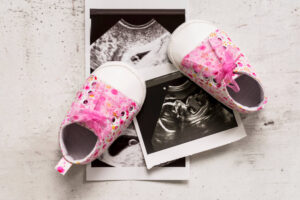 ultrasound pictures with pink baby trainers