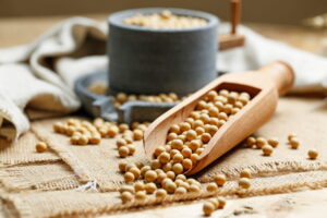 Soy beans on wooden spoon
