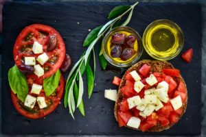 tomatoes, cheese, olives on a plate