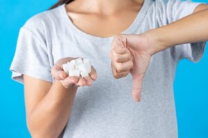 Sugar cubes in women's hand